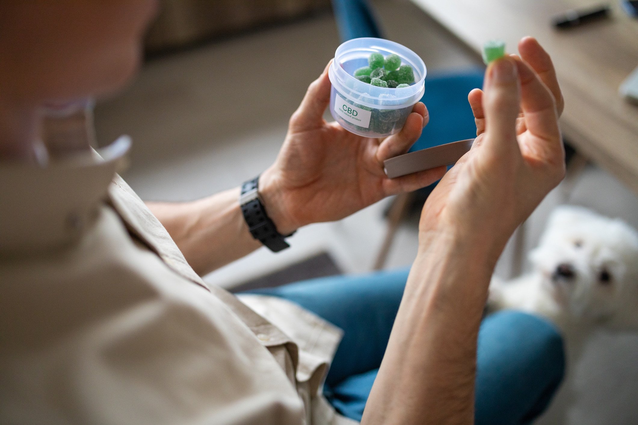 Man holding CBD gummy candy