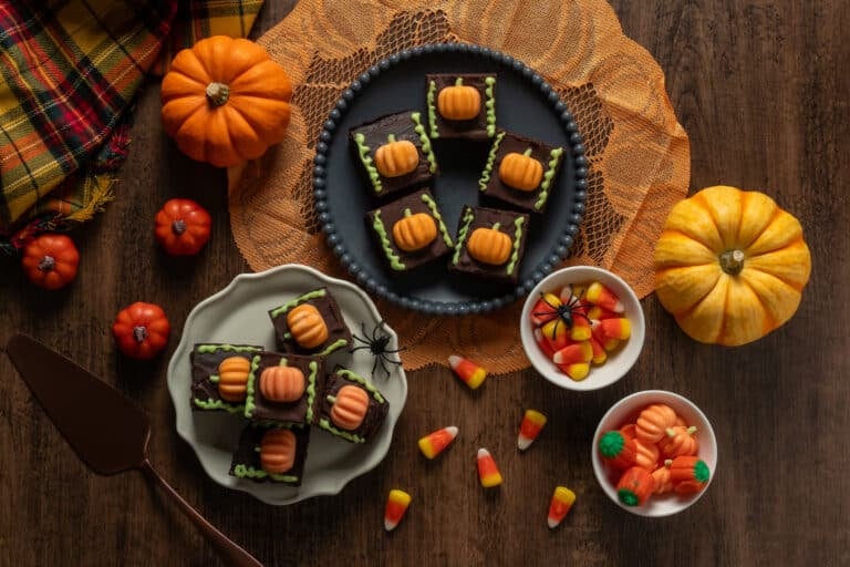 Homemade brownies with chocolate pumpkins on plate