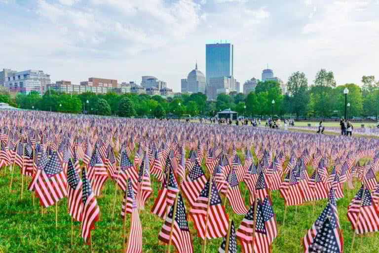 Boston, USA - May 27, 2016: View of thousands of US flags planted in Boston Common, to commemorate fallen soldiers in wars, during Memorial Day weekend