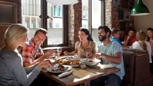 Group of friends enjoying a meal in a restaurant.