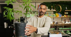 A budtender works inside of a retail cannabis shop in Oregon.