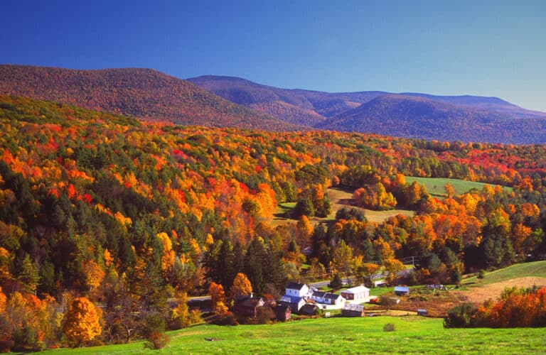 Autumn foliage in the Bershire Hills region of Massachusetts. Photo taken from a scenic viewpoint of the Mount Greylock Range during the peak fall foliage season. The Berkshires region enjoys a vibrant tourism industry based on music, arts, and recreation.