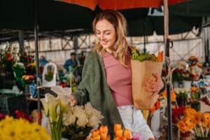 Women buying flowers at market
